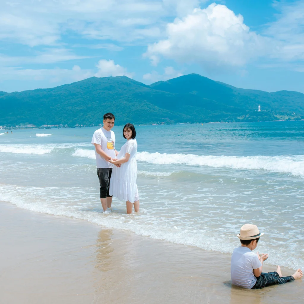 My Khe Beach Da Nang pristine white sand coastline with crystal clear blue water and palm trees